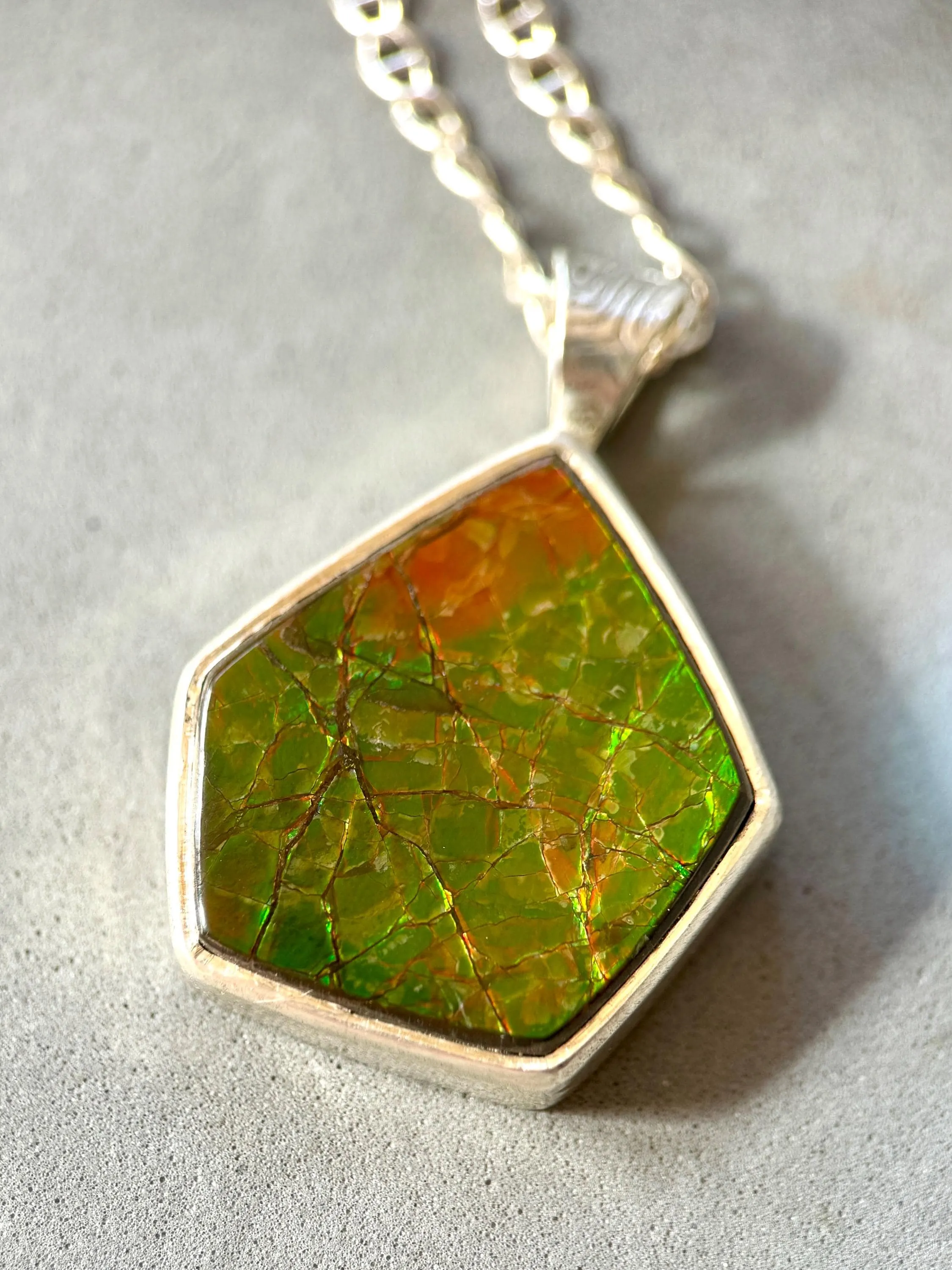 Geometric Ammonite pendant in Sterling Silver, iridescent green