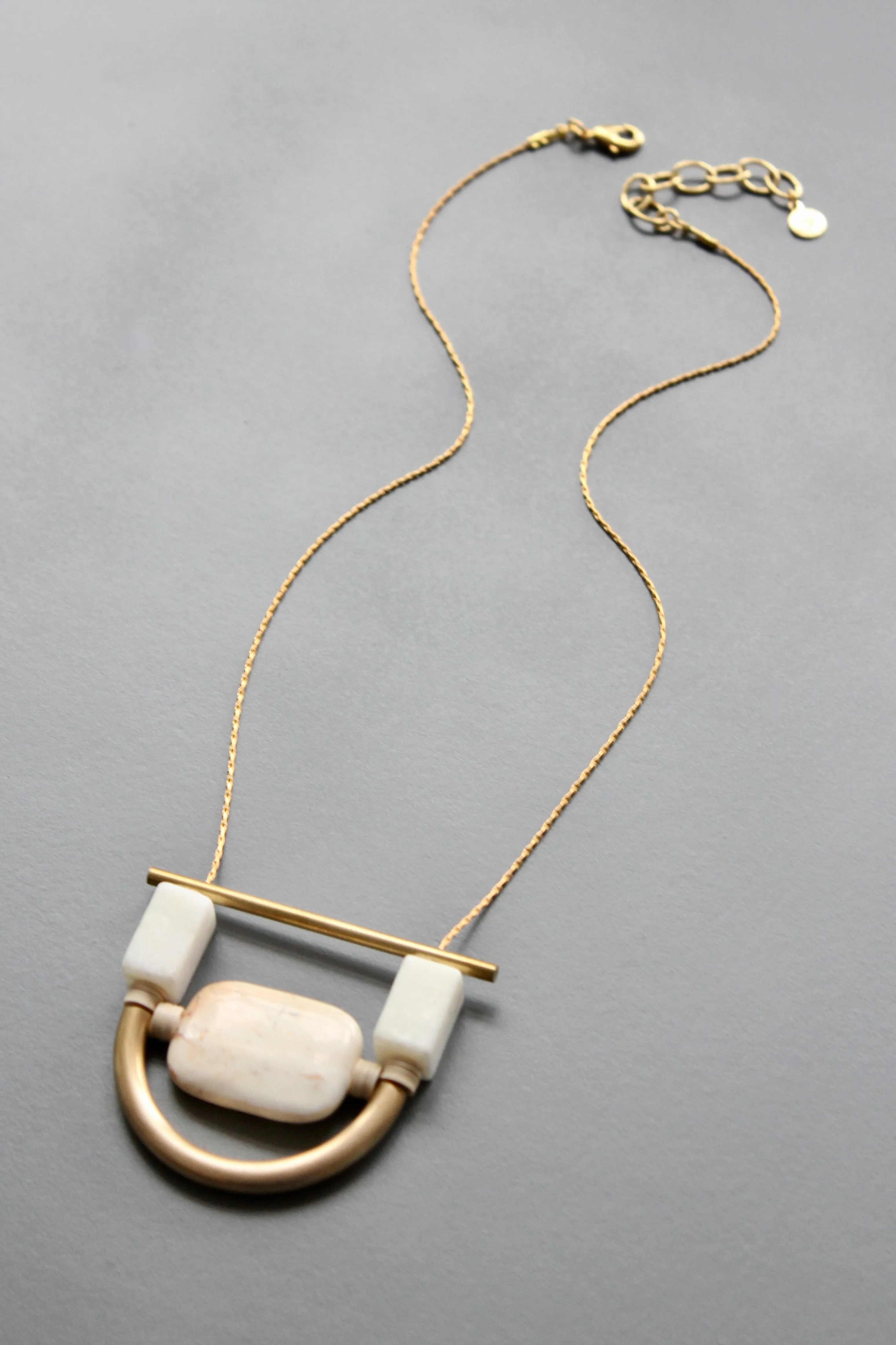 ISL117 White stone and brass geometric necklace