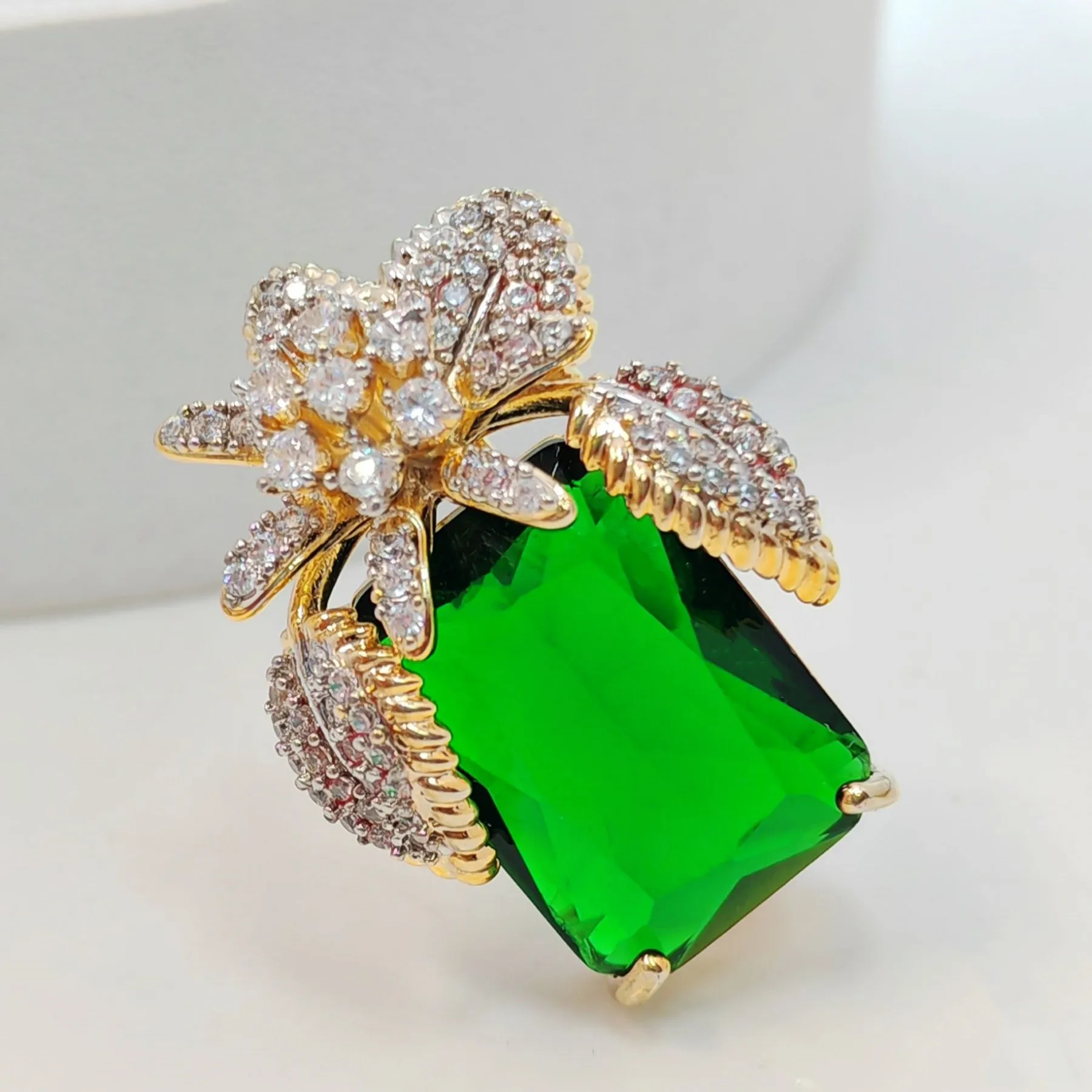 Vase-Shaped Brooch with Gold Tone Flower Design – Transparent Simulated Zircon Stamen and Green Square Center Stone – Elegant Square Pin for Women