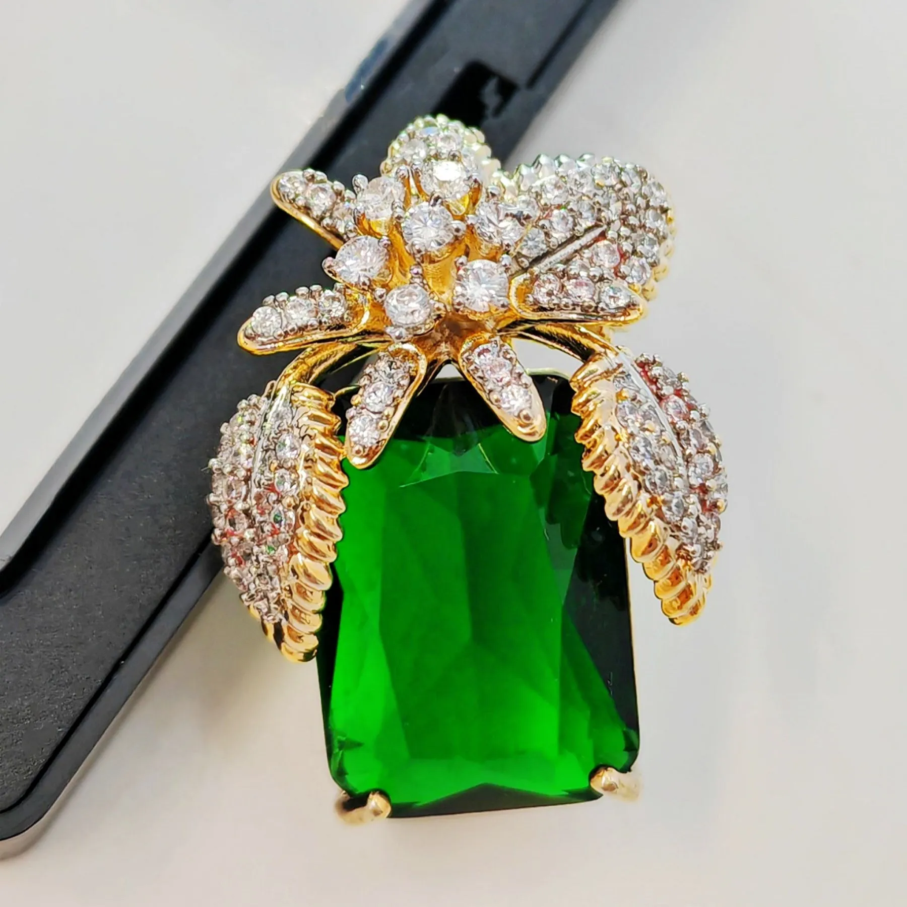 Vase-Shaped Brooch with Gold Tone Flower Design – Transparent Simulated Zircon Stamen and Green Square Center Stone – Elegant Square Pin for Women
