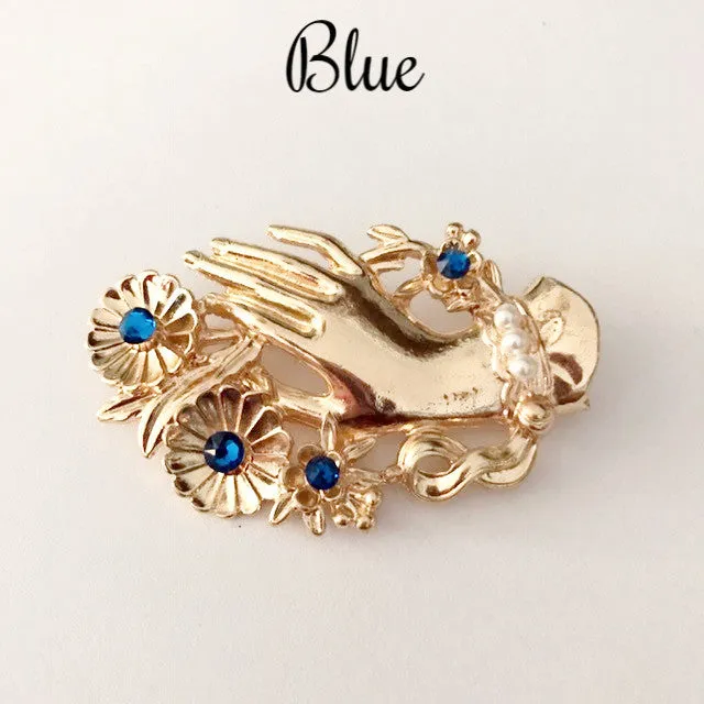 Vintage hand brooch with gem bouquet
