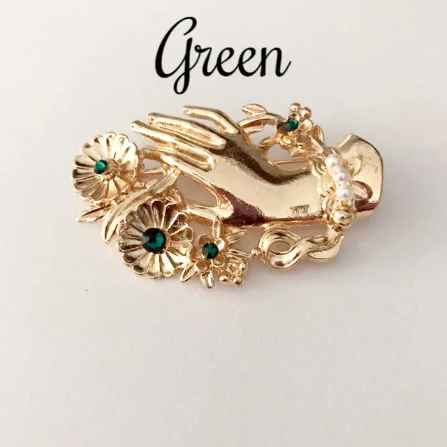 Vintage hand brooch with gem bouquet